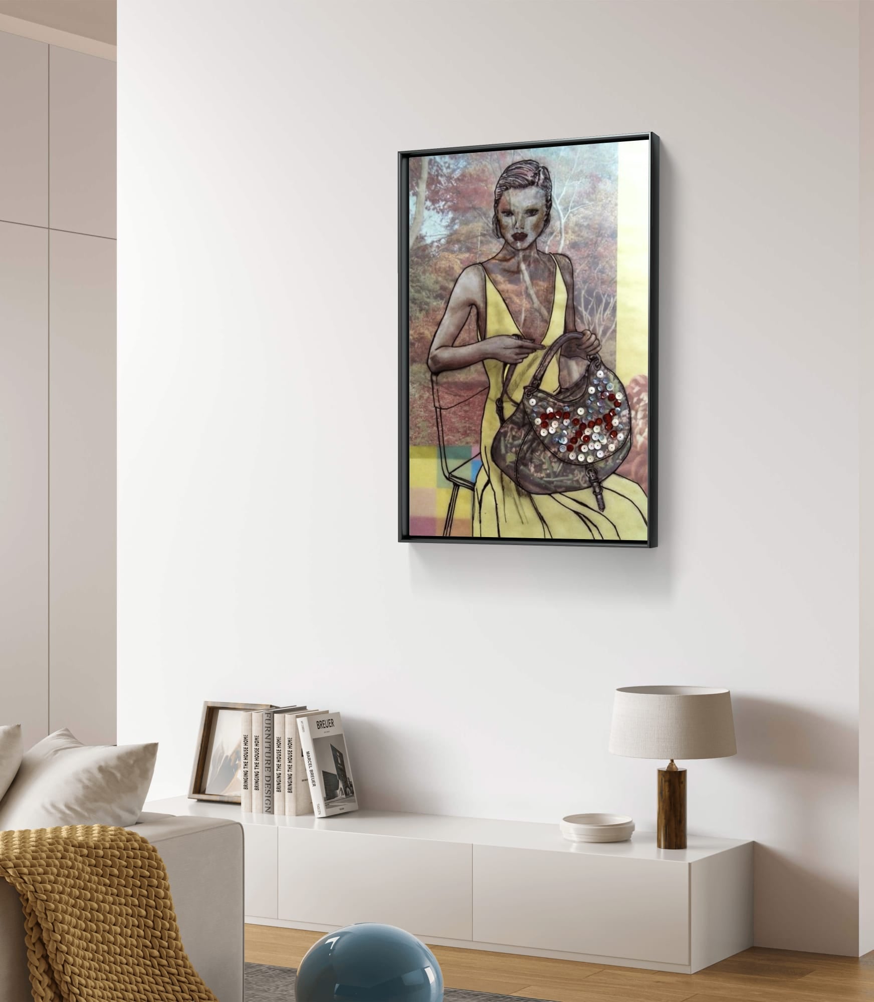Black Framed artwork of a woman holding a SEQUIN BAG in a modern living room.